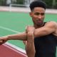handsome african athlete man make stretching exercises