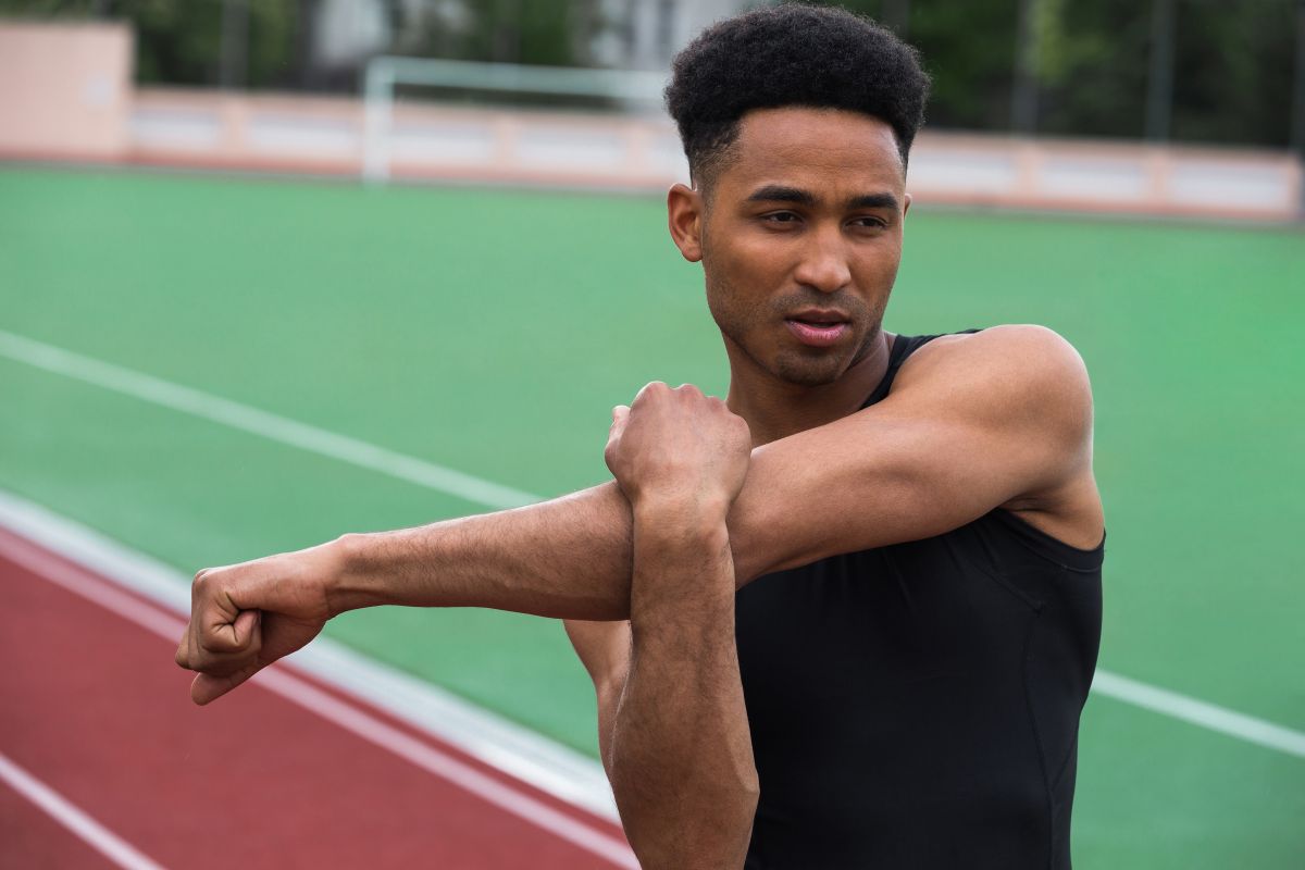 handsome african athlete man make stretching