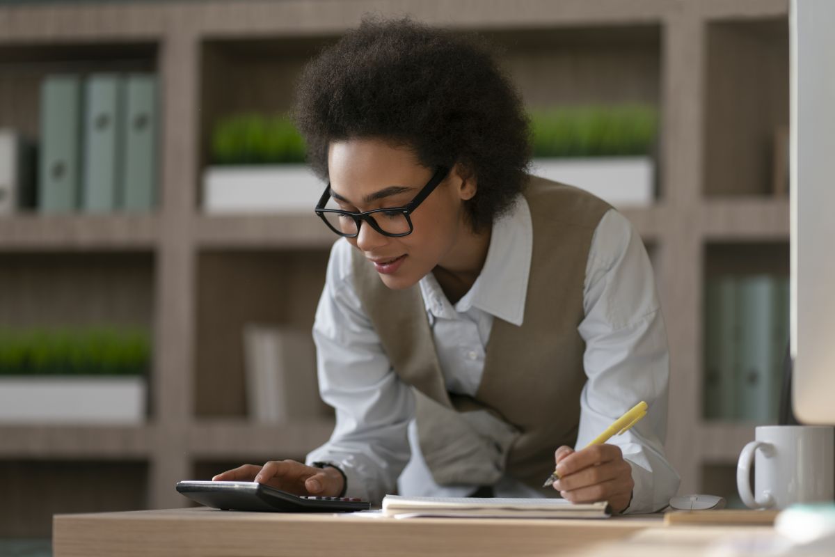 medium shot woman working as economist