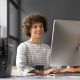 side view woman working computer